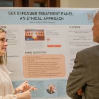 Nicole explaining research to Dr. Potteiger